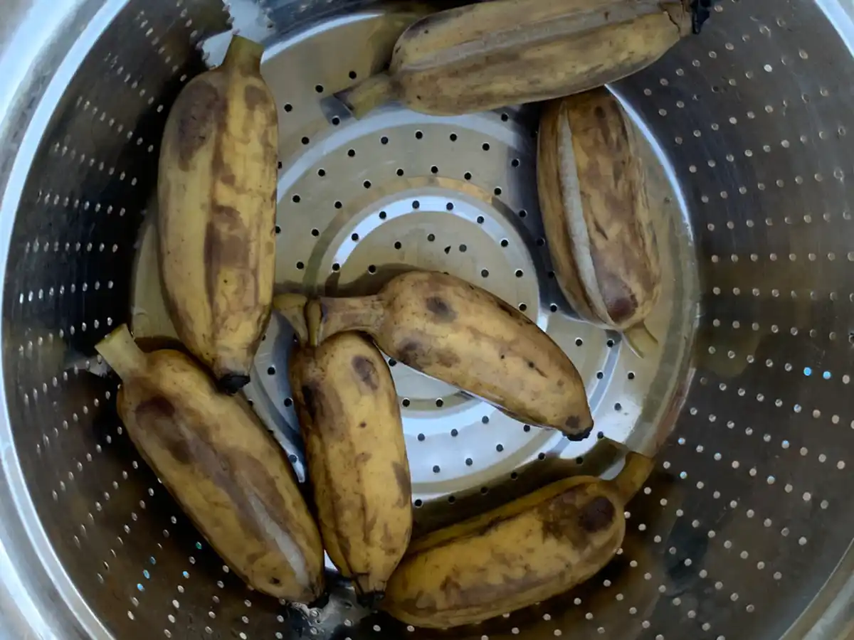 Ripe bananas in a sieve.