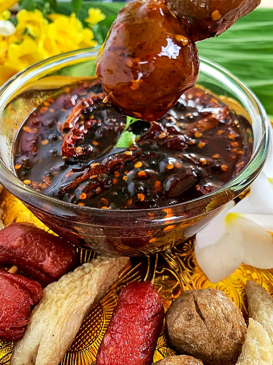 Thai spicy tamarind sauce served with fried snacks and vegetables.