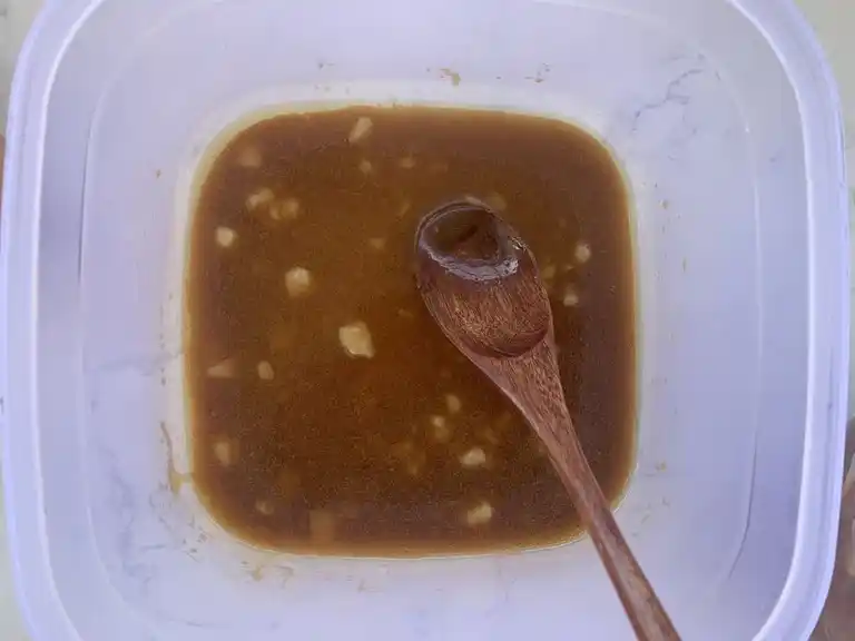 A marinade of Thai seasonings and sauces in a bowl.