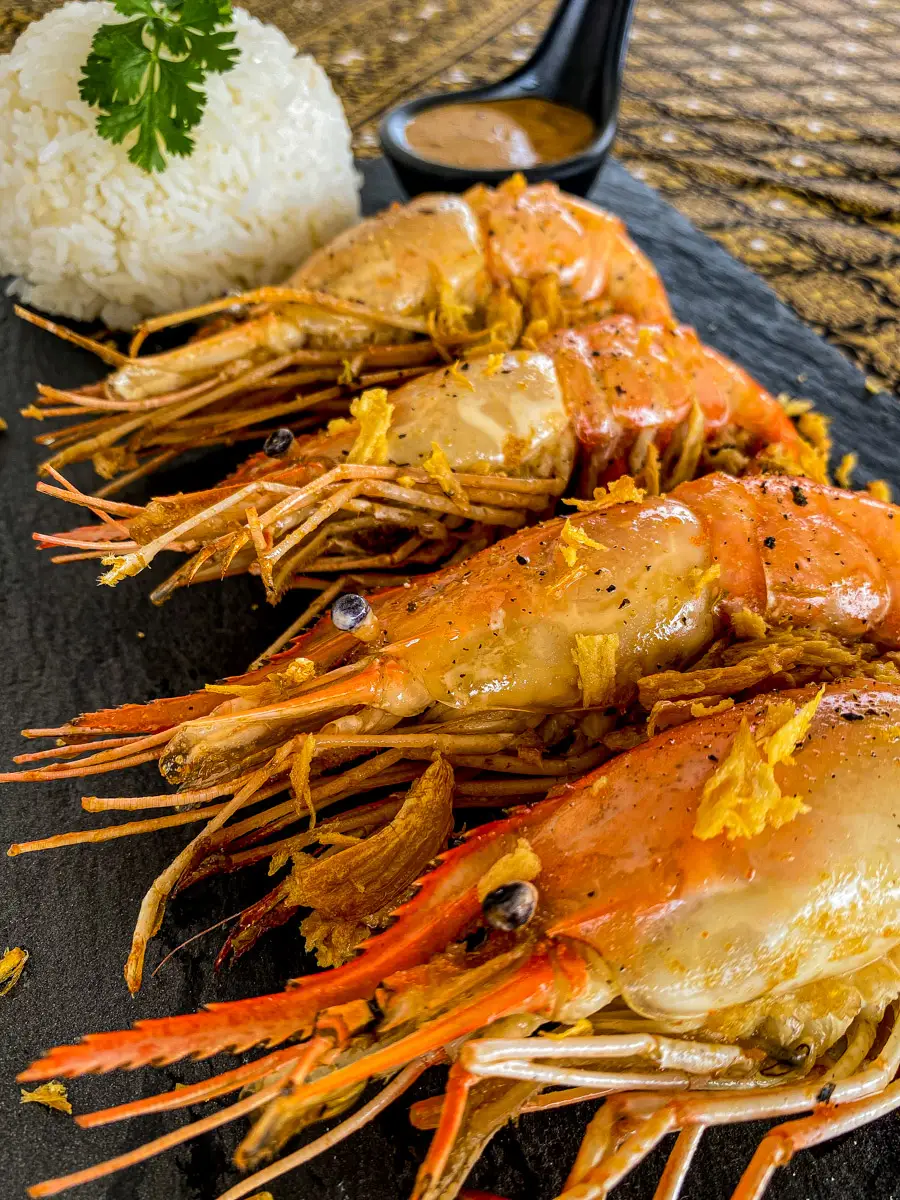 Garlic prawns with rice and a creamy sauce.
