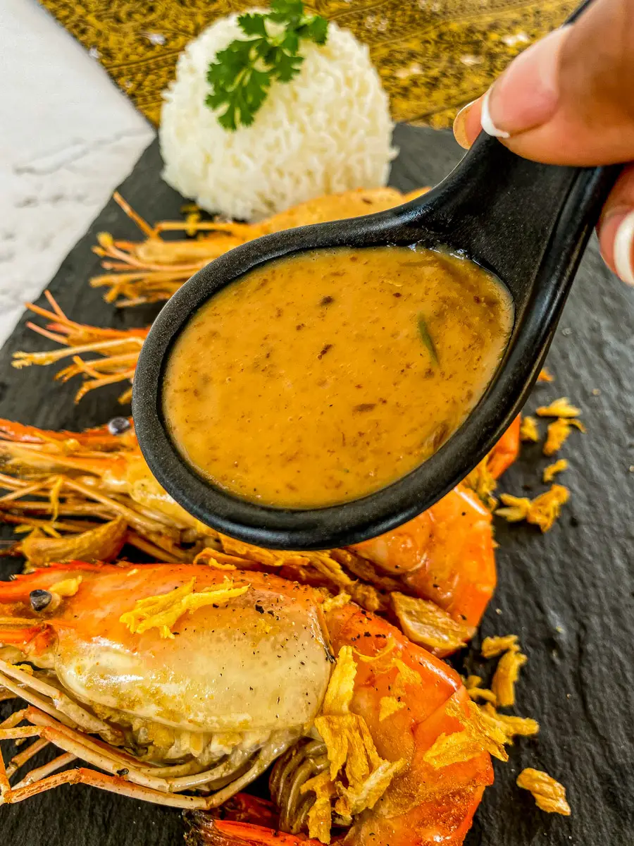 Garlic prawns with a creamy sauce over it, and white rice.
