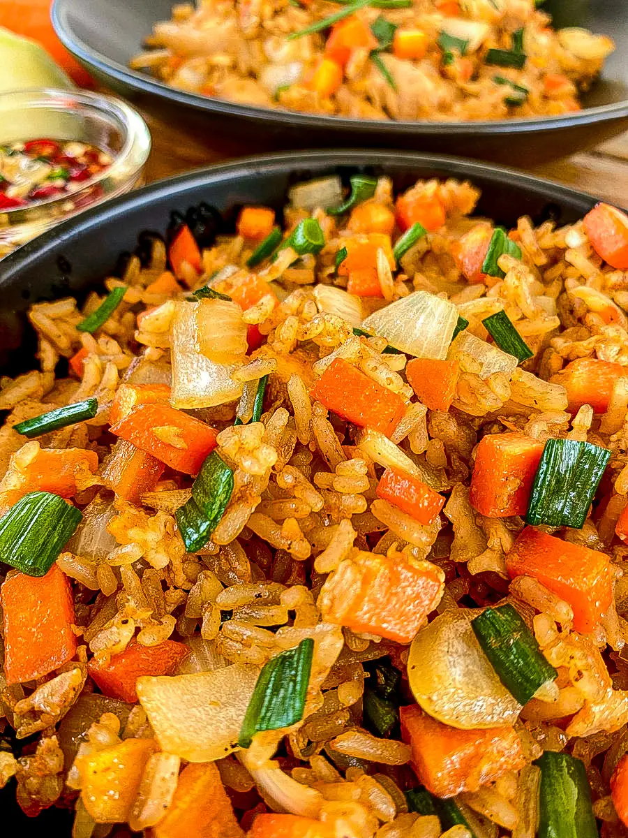 Close-up of leftover rice fried rice with vegetables and pork.