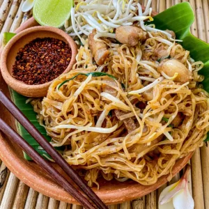 Pad mee korat, a traditional Thai rice noodle stir-fry made with pork belly and bean sprouts.