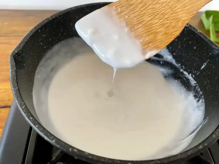 Coconut sauce preparation in a pot.