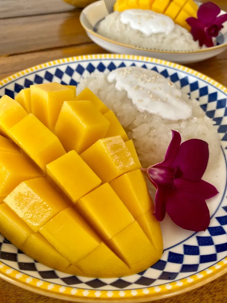 Easy mango sticky rice dessert served on a patterned dish.
