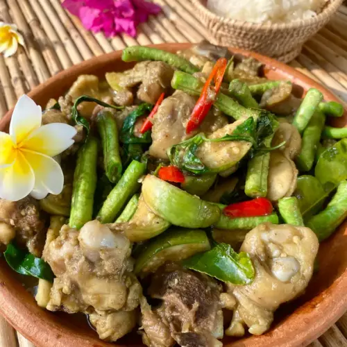 Thai green curry stir-fry with chicken and vegetables served with jasmine rice.