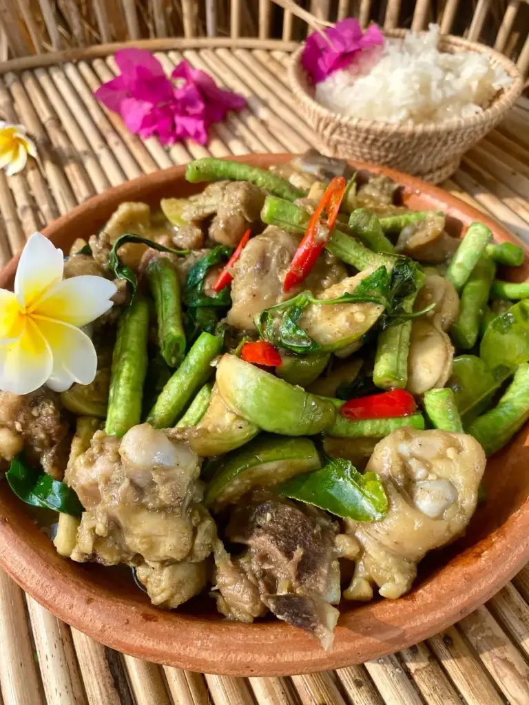 Thai green curry stir-fry with chicken and vegetables served with jasmine rice.