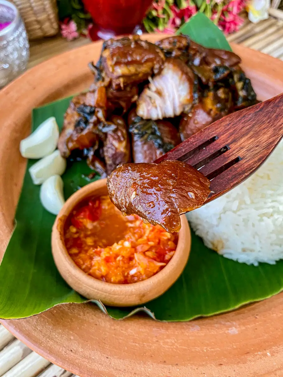 Asian braised pork belly with dipping sauce.