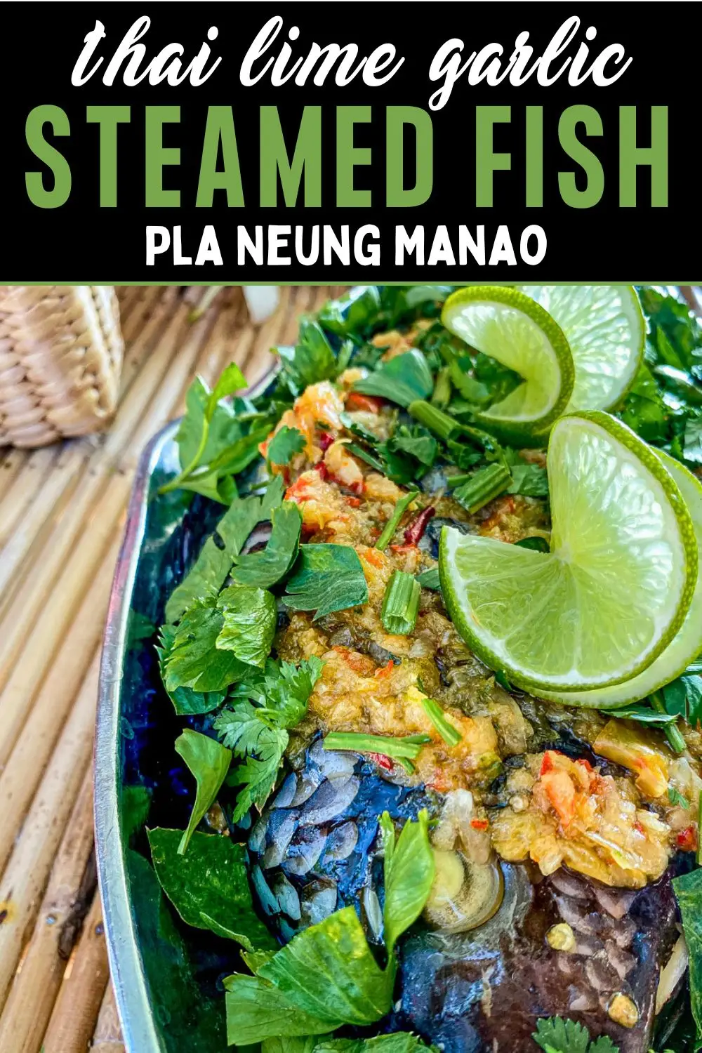 Thai lime garlic steamed fish (Pla Neung Manao) topped with fresh coriander, Chinese celery, chilies, and lime wedges.