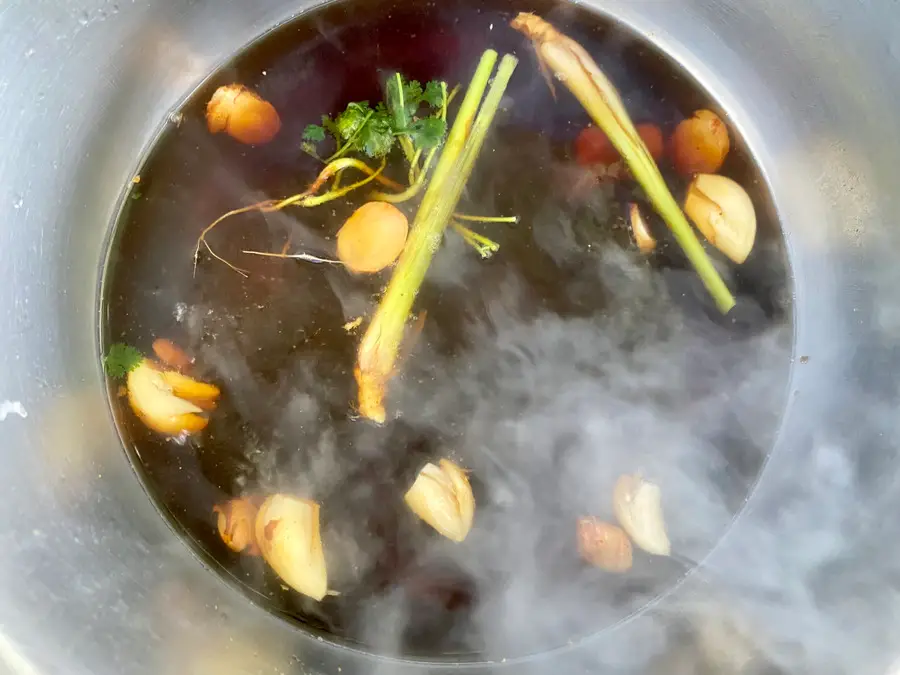 Thai chicken broth with fish sauce, soy sauce, and fragrant herbs.