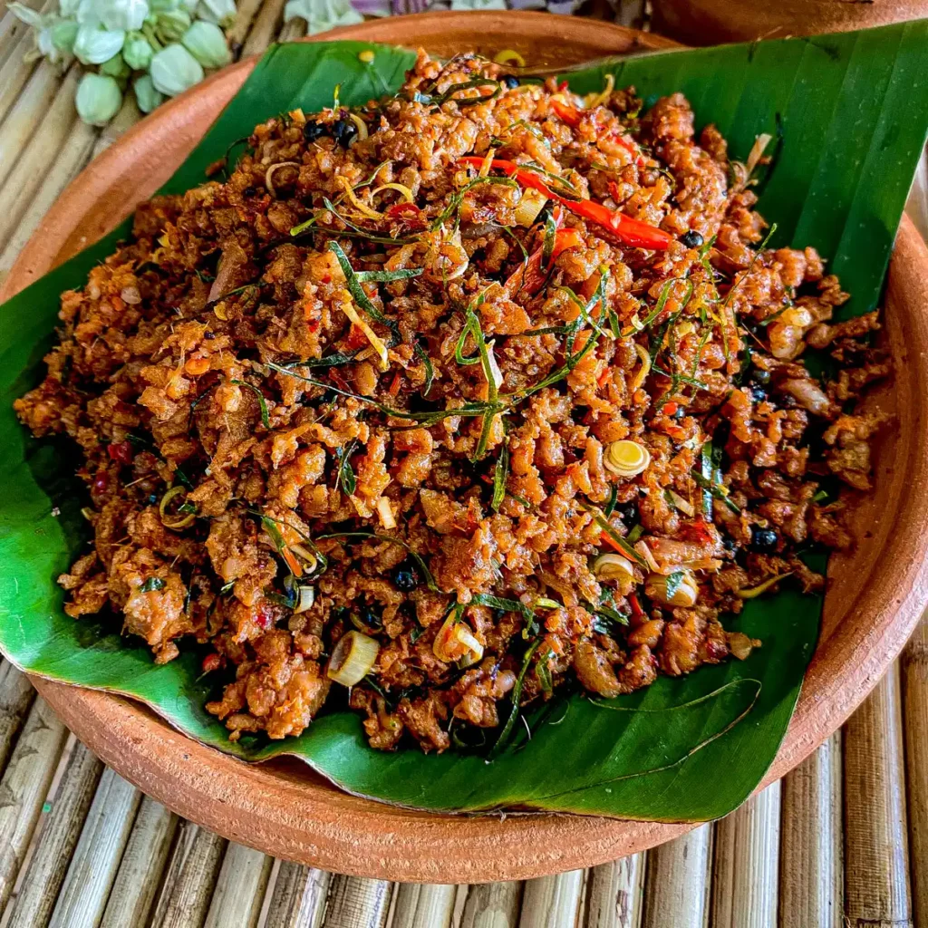 Khua kling, a Thai dry mince curry, served in a clay dish.