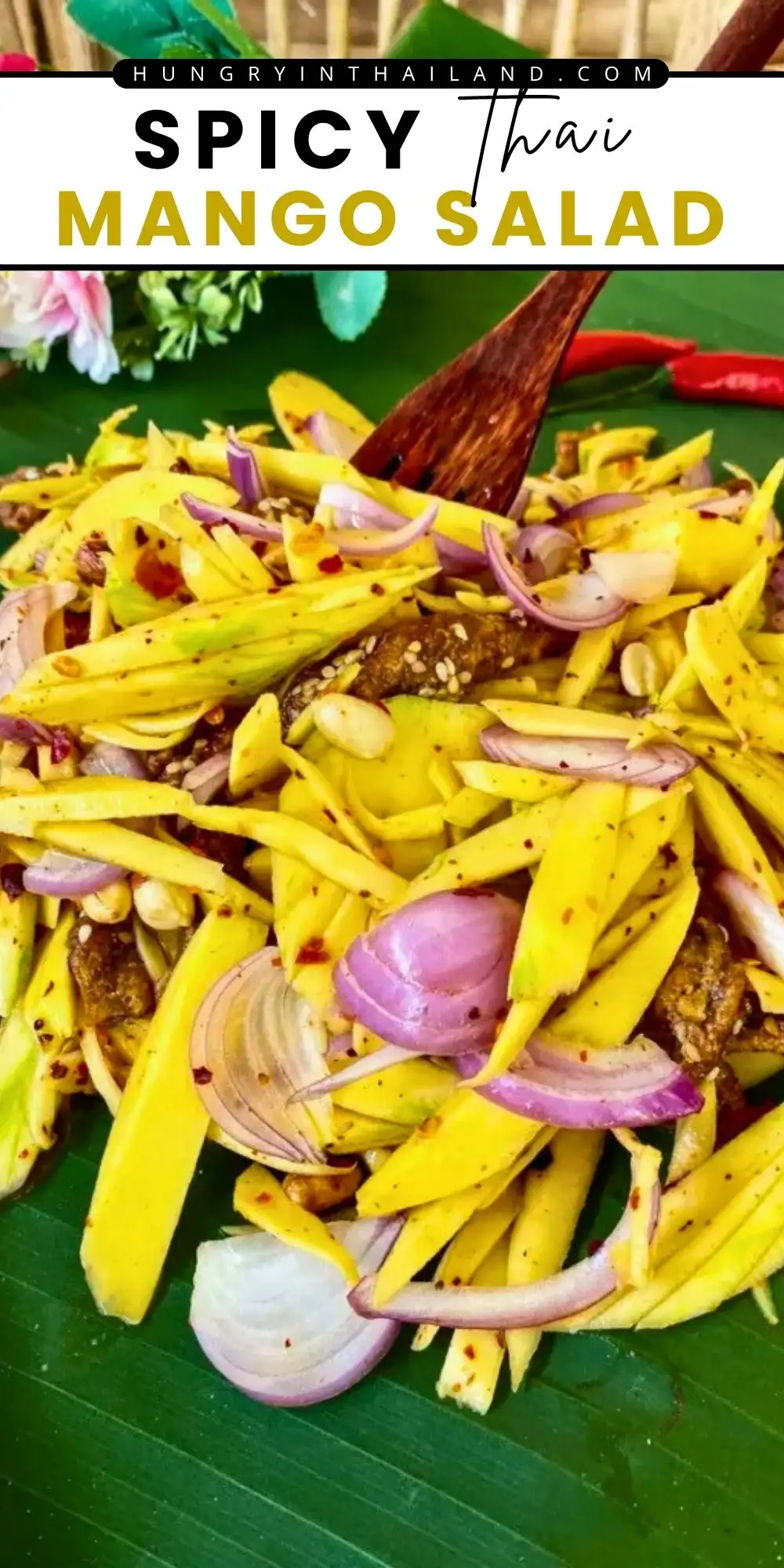 Spicy Thai mango salad with green mango, shallots, chilies, peanuts, and tangy lime dressing.
