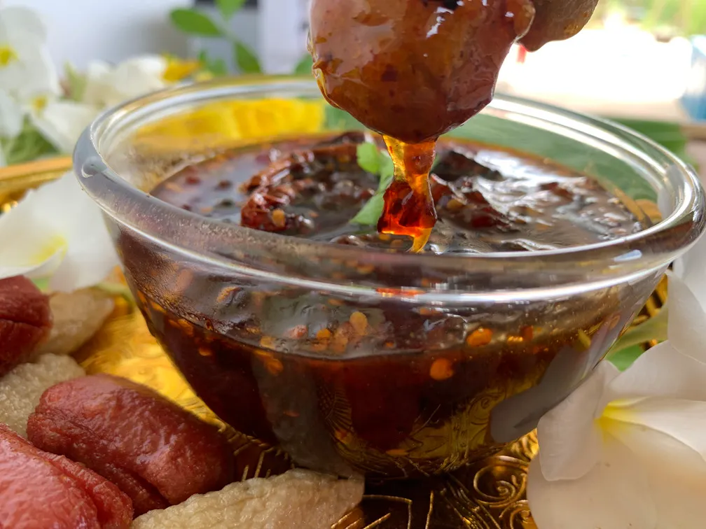 Spicy tamarind dipping sauce with meatball.