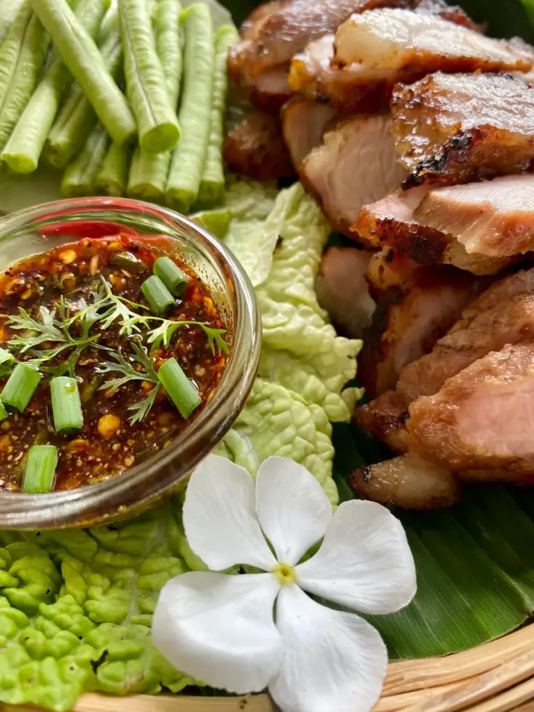 Kor moo yang sauce served with Thai grilled pork neck slices.