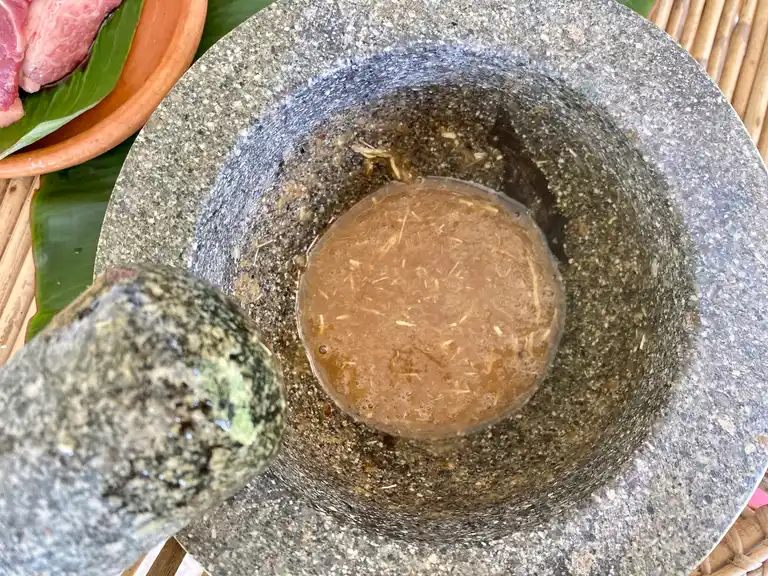 Thai pork marinade sauce in a granite mortar.
