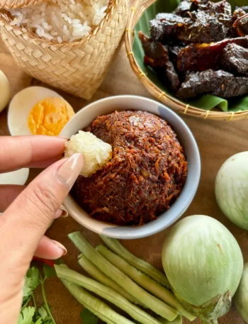 Jeow bong, a Lao chili paste, with fresh vegetables and sticky rice.