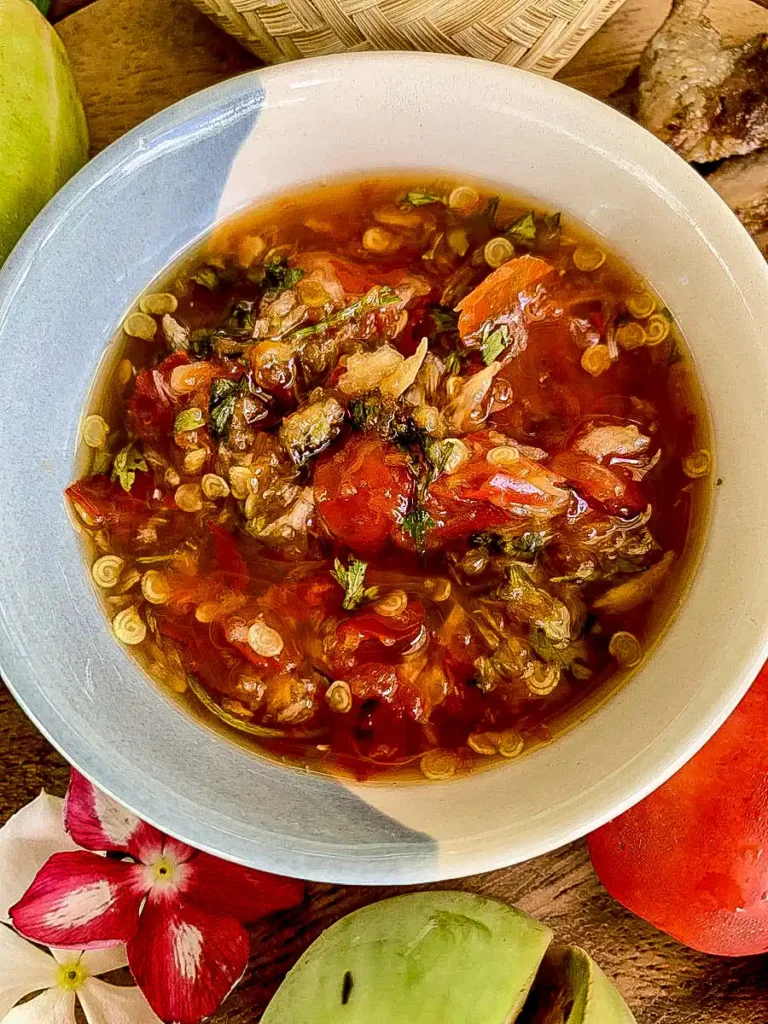 Jeow som dipping sauce showing roasted tomato and chili texture.
