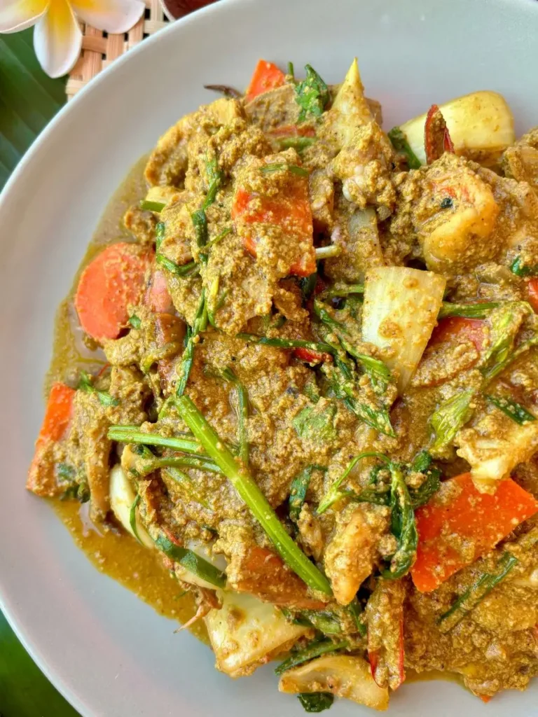 Authentic pad pong karee talay with fresh seafood and vegetables in a yellow curry sauce.