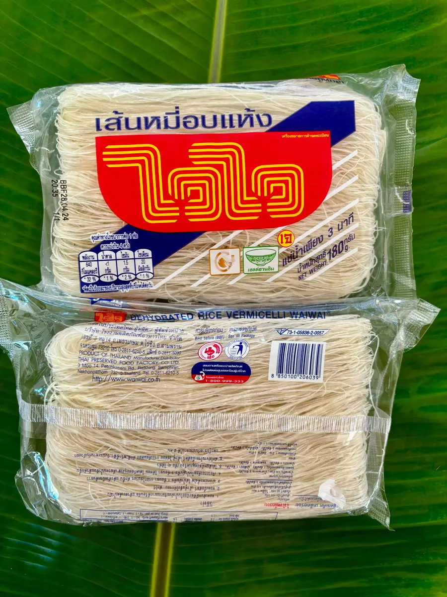 Pack of rice vermicelli noodles set against a banana leaf.