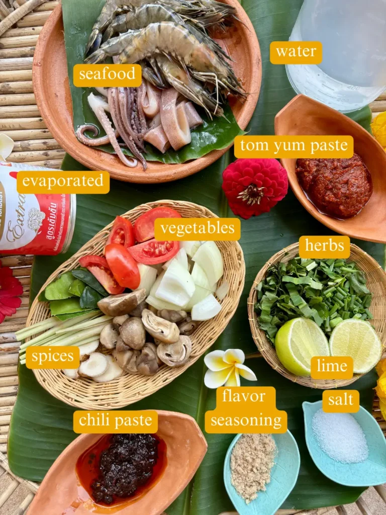 Tom yum talay ingredients labeled: shrimp, squid, water, tom yum paste, evaporated milk, herbs, lime, salt, flavor seasoning, galangal, mushrooms, tomatoes, onion, lemongrass, kaffir lime leaves, chili paste.