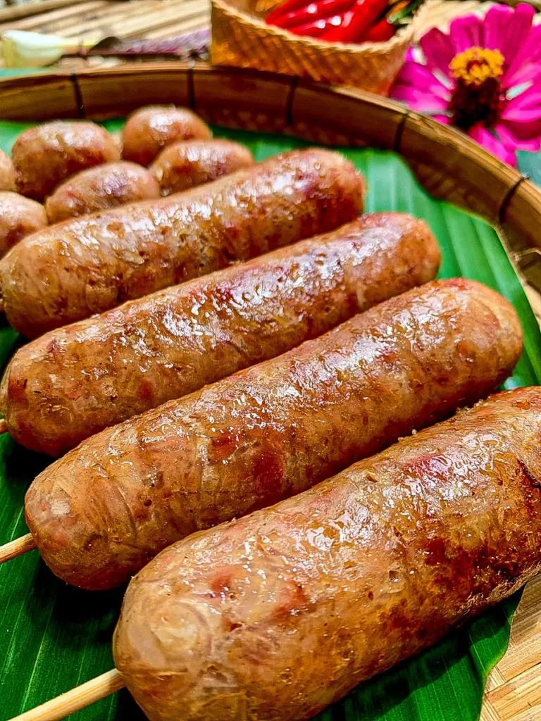 Sai krok Isan sausages served on a banana leaf.