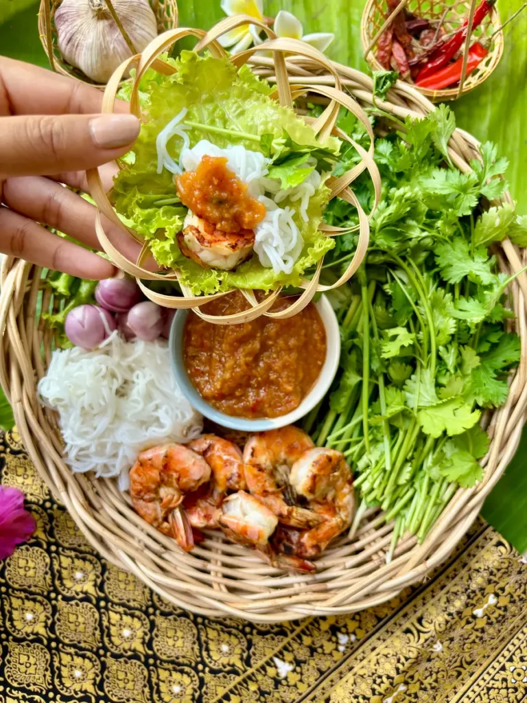 Thai lettuce wraps with peanut sauce, shrimp, rice vermicelli, coriander, and fresh vegetables.