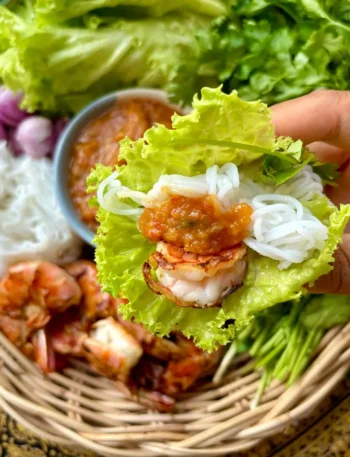 Thai shrimp lettuce wraps with peanut sauce, rice vermicelli, and fresh vegetables.