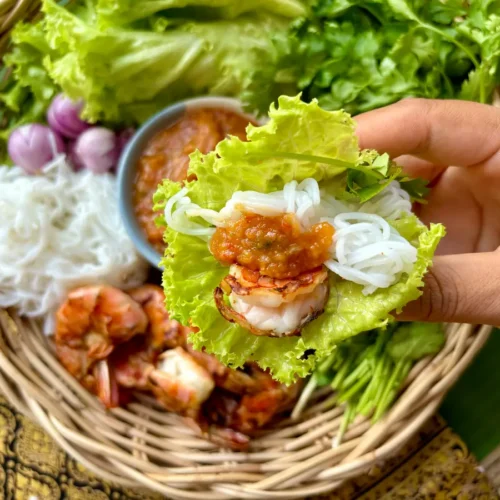 Thai shrimp lettuce wraps with peanut sauce, rice vermicelli, and fresh vegetables.