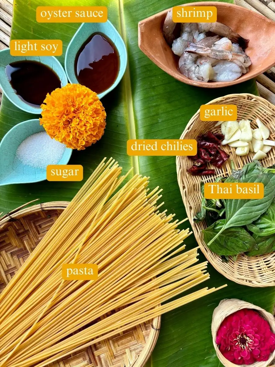 Ingredients for Thai basil pasta labeled: Oyster sauce, light soy sauce, shrimp, garlic,  sugar, Thai basil, and pasta.