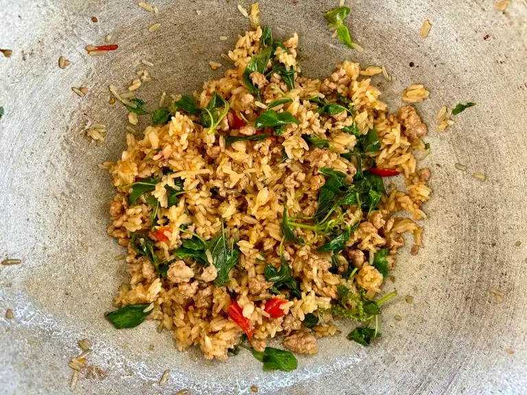 Ka pao fried rice ready in a wok.