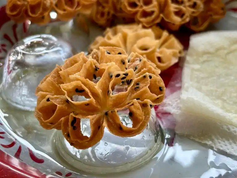 Fried Thai lotus cookie on a small bowl.