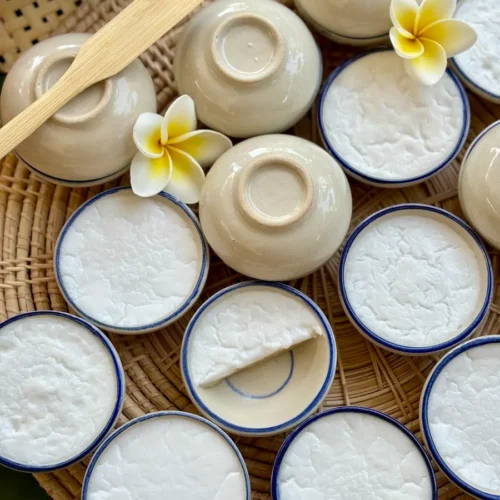 Thai coconut custard, khanom tuay, in small ceramic bowls.