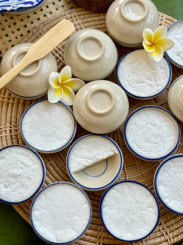 Thai coconut custard, khanom tuay, in small ceramic bowls.