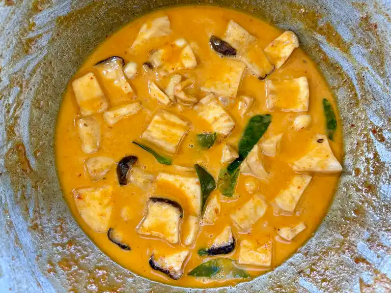Vegetarian Thai mushroom curry ready in a wok.