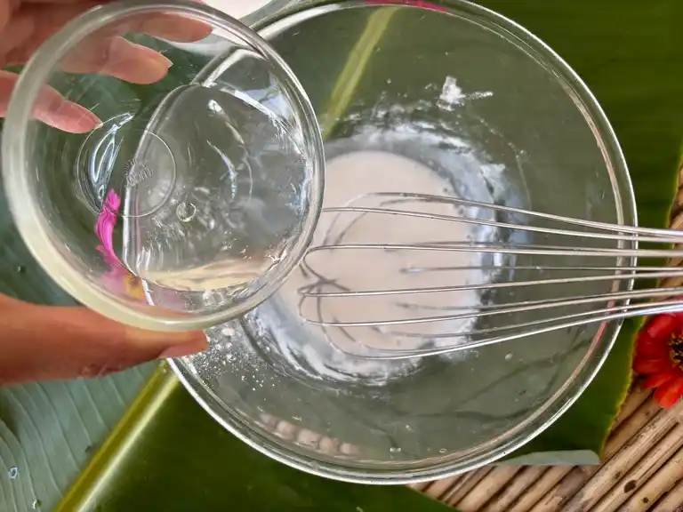 Water whisked into rice flour mixture.