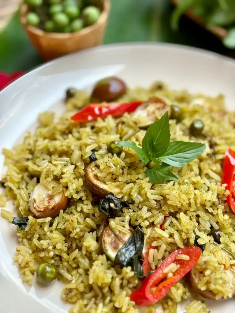 Close-up of Thai green curry fried rice, also known as kao pad gaeng keow wan gai.