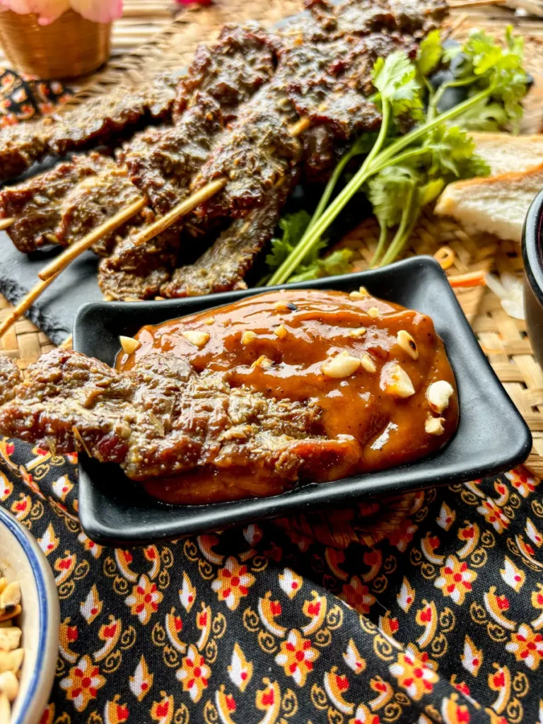 Thai beef satay dipped into peanut sauce.