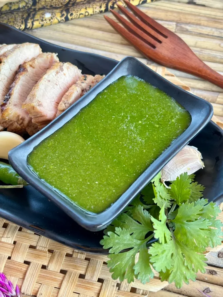 Thai coriander sauce served with a side of grilled pork and fresh coriander.