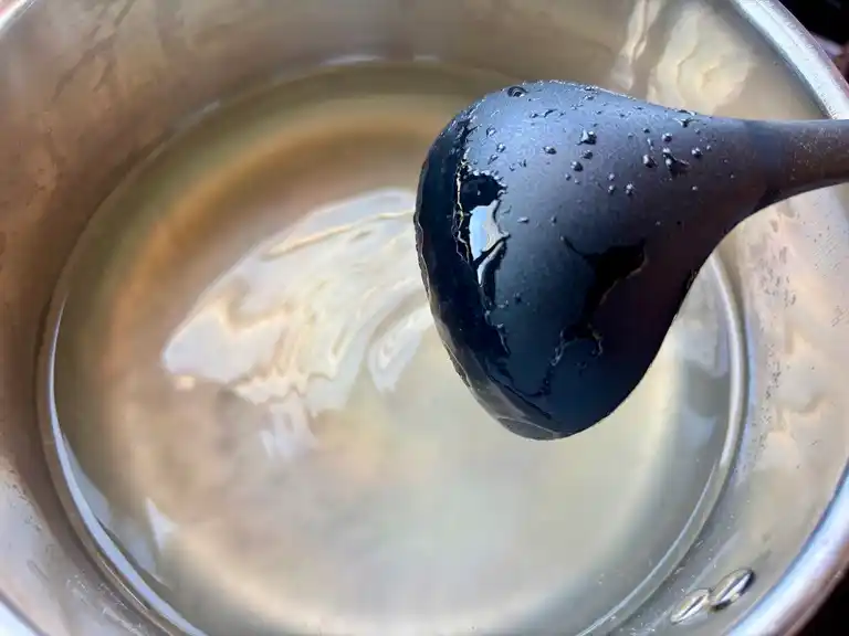 Hot agar-agar mixture boiling in a saucepan.