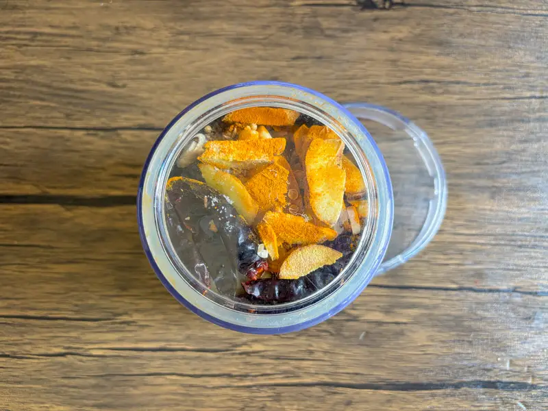 Yellow curry paste ingredients placed in a blender.