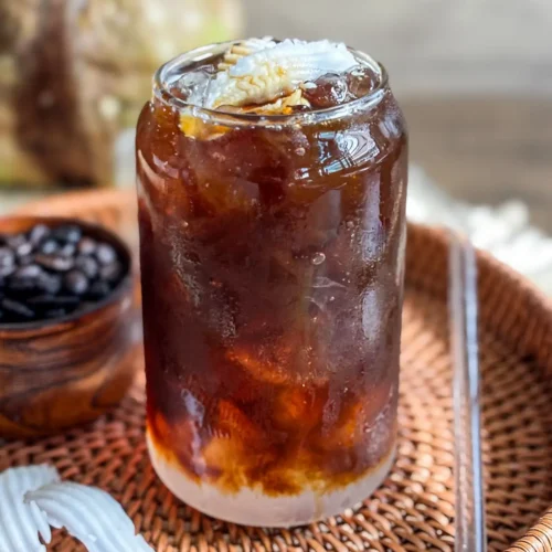 Iced coconut water coffee made with young coconut water served over ice.