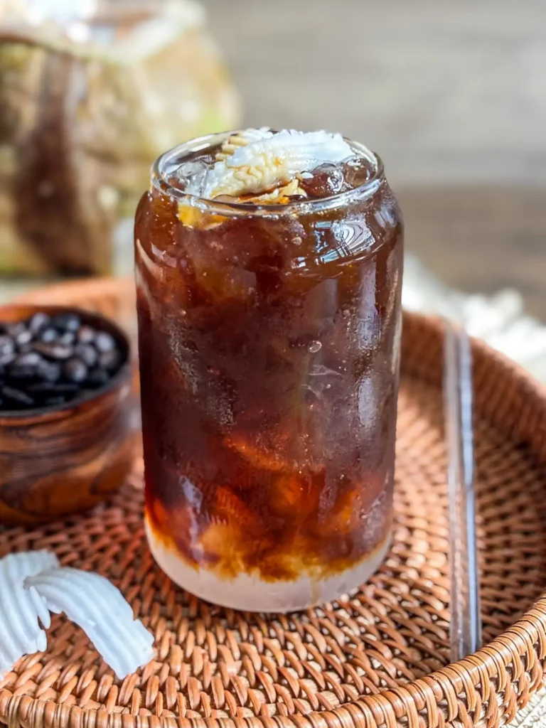Iced coconut water coffee made with young coconut water served over ice.