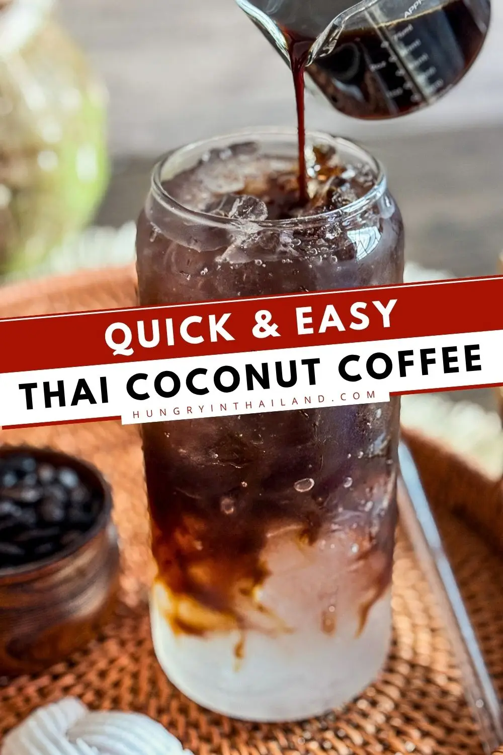 Iced coconut water coffee poured over ice with espresso and coconut water in a glass.