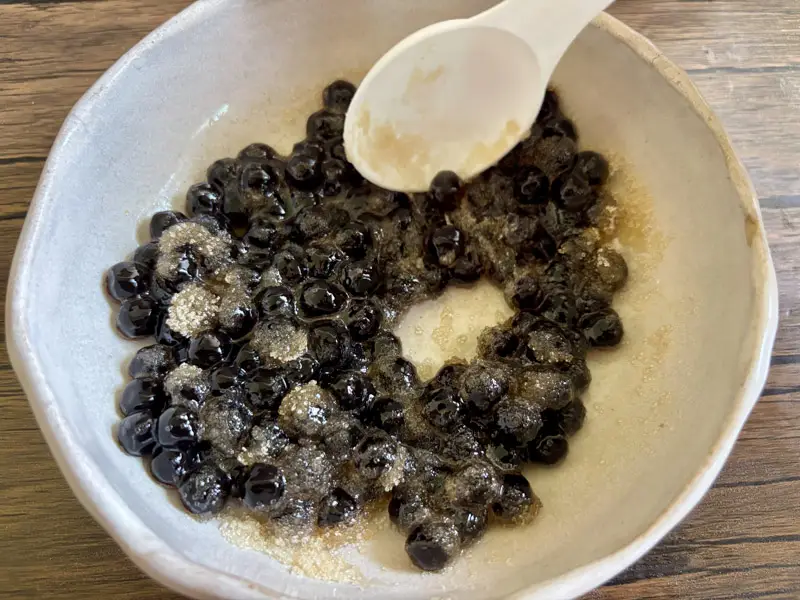 Cooked tapioca pearls tossed with sugar.