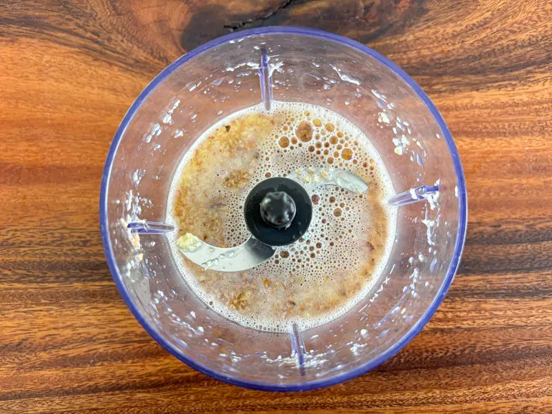 Blended ginger mixture in a food processor.