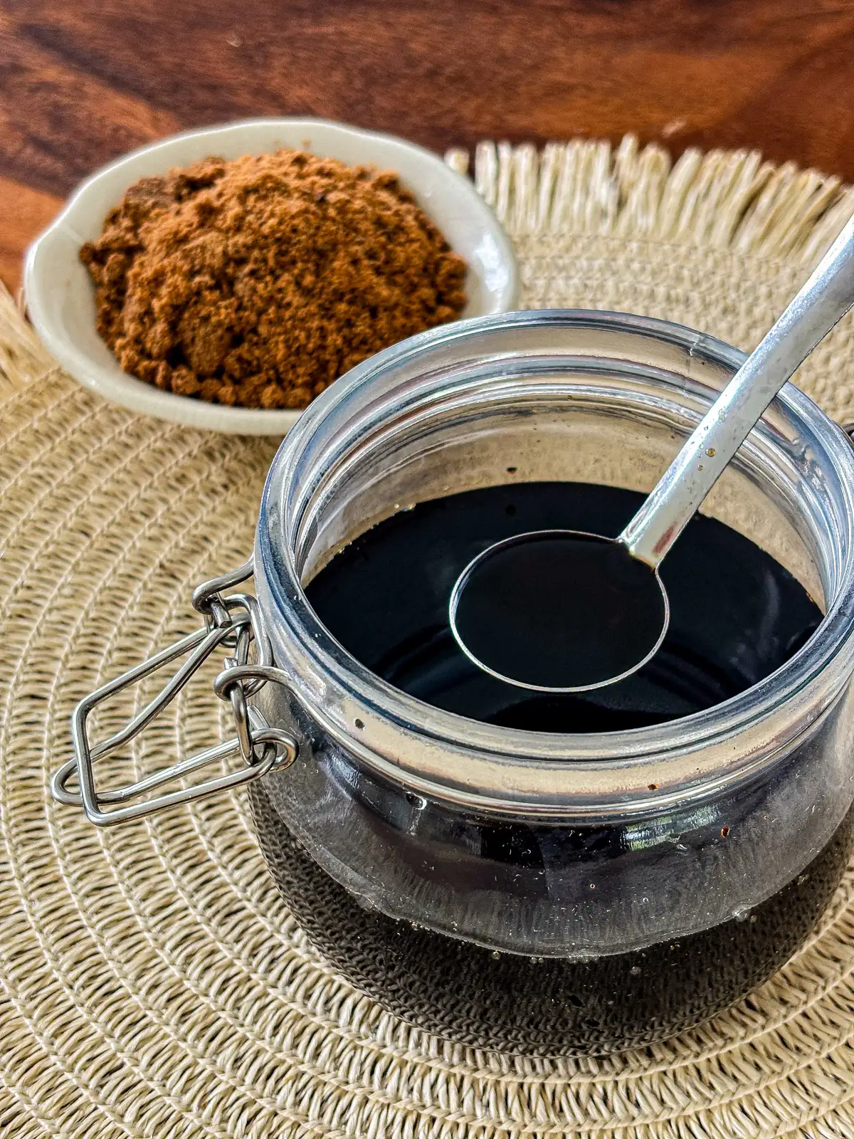 Homemade brown sugar simple syrup stored in a glass jar.