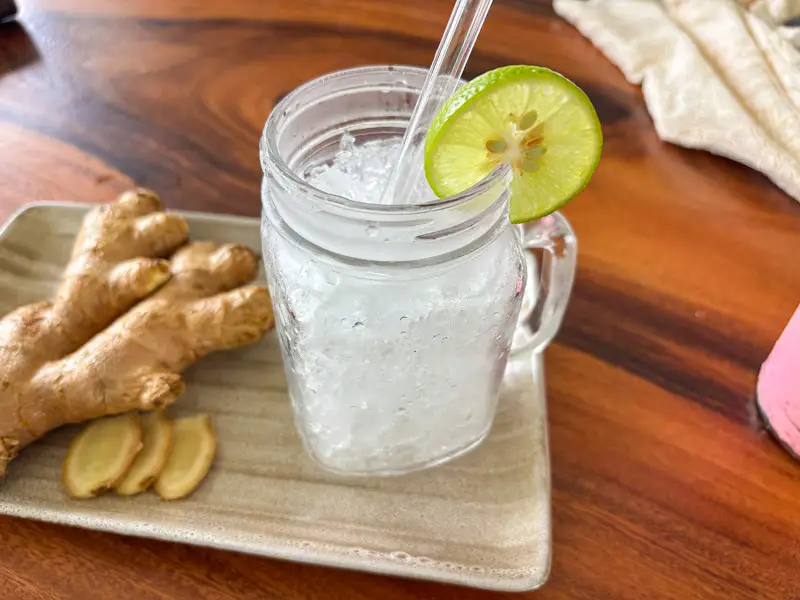 Glass filled with ice for homemade ginger soda.