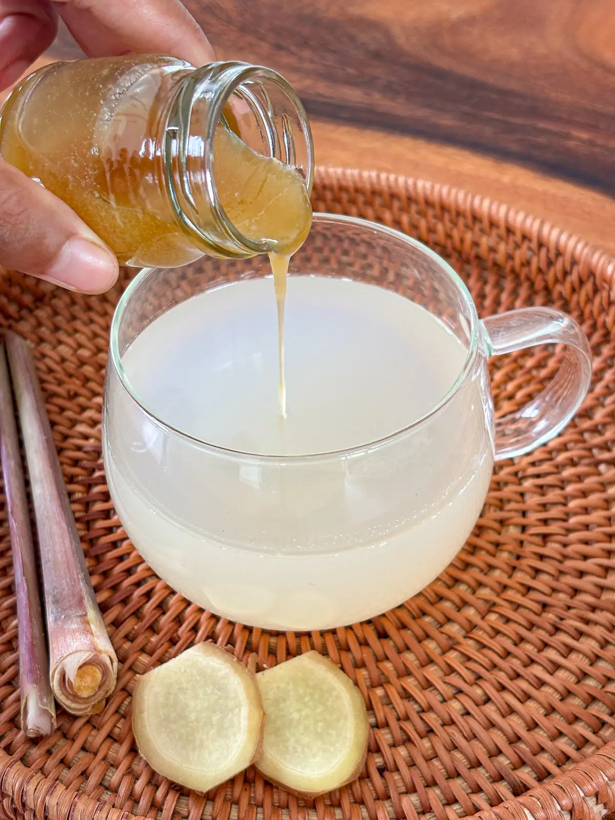 Honey drizzled into lemongrass ginger tea.