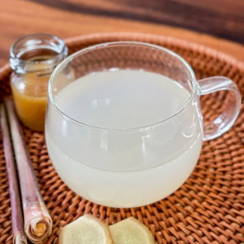Lemongrass ginger tea served with fresh ginger and lemongrass.