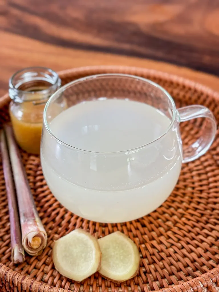 Lemongrass ginger tea served with fresh ginger and lemongrass.